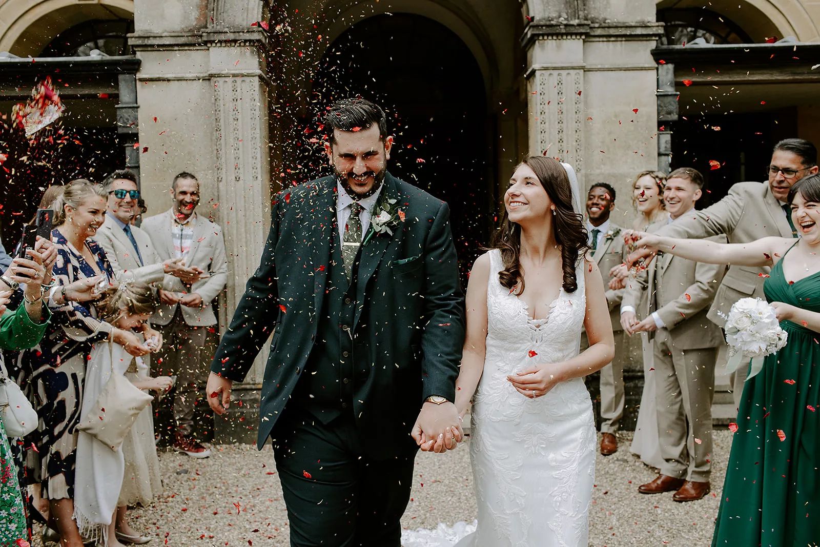 Anna & Jake smiling during their personalised wedding ceremony at Coombe Lodge, led by Somerset wedding celebrant Eleanor Willock