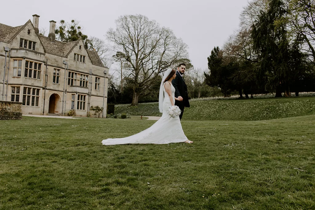 Anna & Jake smiling during their personalised wedding ceremony at Coombe Lodge, led by Somerset wedding celebrant Eleanor Willock